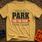 Parking With Purpose - T-Shirt in Mustard - A typographic design featuring the text 'RULE #2: PARK' and 'FOR THE VIEW'...