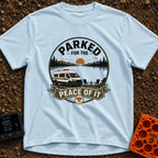 Parked For Some Peace - T-Shirt in Chambray - An illustration of a camper van parked next to a calm lake with mountains...