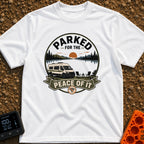 Parked For Some Peace - T-Shirt in White - An illustration of a camper van parked next to a calm lake with mountains and...