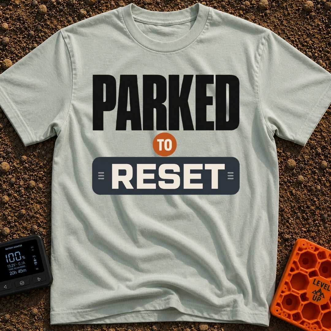 Parked To Reset - T-Shirt in Bay - A typographic design that reads "PARKED TO RESET". The word "PARKED" is in large black...