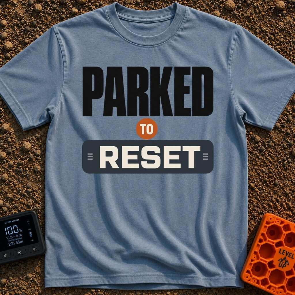 Parked To Reset - T-Shirt in Blue Jean - A typographic design that reads "PARKED TO RESET". The word "PARKED" is in large...