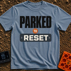 Parked To Reset - T-Shirt in Blue Jean - A typographic design that reads "PARKED TO RESET". The word "PARKED" is in large...