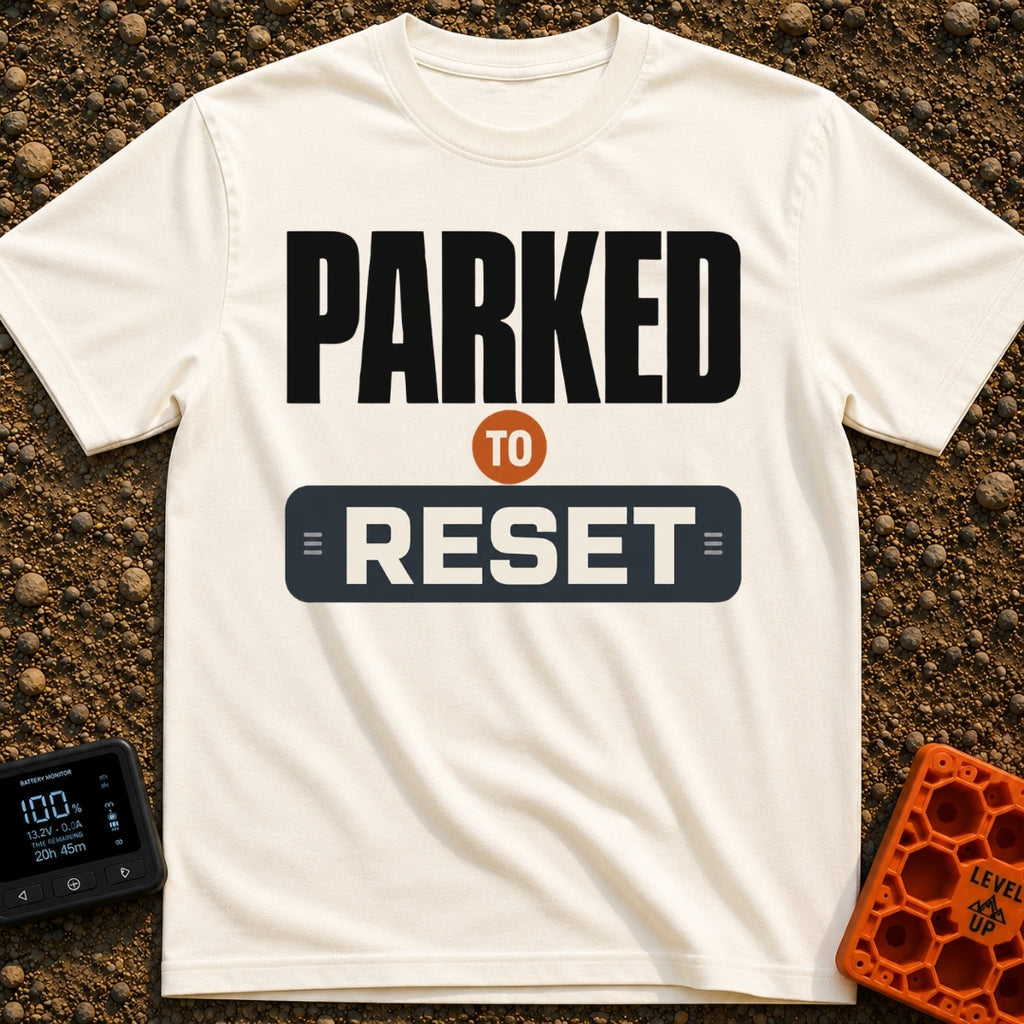Parked To Reset - T-Shirt in Ivory - A typographic design that reads "PARKED TO RESET". The word "PARKED" is in large...