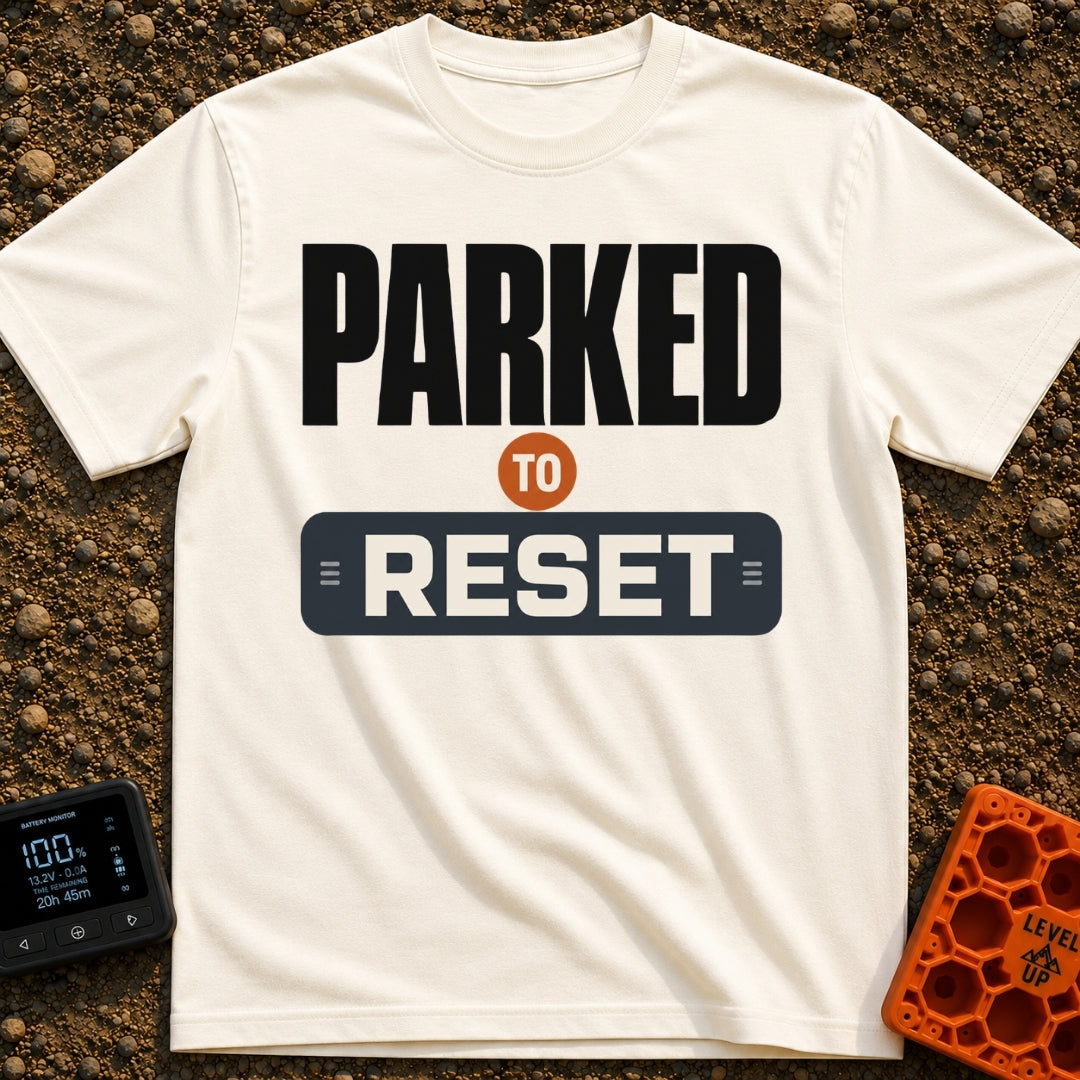 Parked To Reset - T-Shirt in Ivory - A typographic design that reads "PARKED TO RESET". The word "PARKED" is in large...