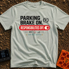 Brakes On Responsibilities Off - T-Shirt in Bay - A typographic design stating "PARKING BRAKE ON." next to a (P) symbol...