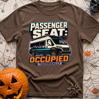 Technically Riding Shotgun - T-Shirt in Espresso - A white camper van with mountain graphics on its side, featuring a...
