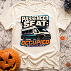 Technically Riding Shotgun - T-Shirt in Ivory - A white camper van with mountain graphics on its side, featuring a...
