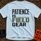 Patience Is Field Gear - T-Shirt in Chambray - A typographic design featuring the stacked text "PATIENCE IS FIELD GEAR"...