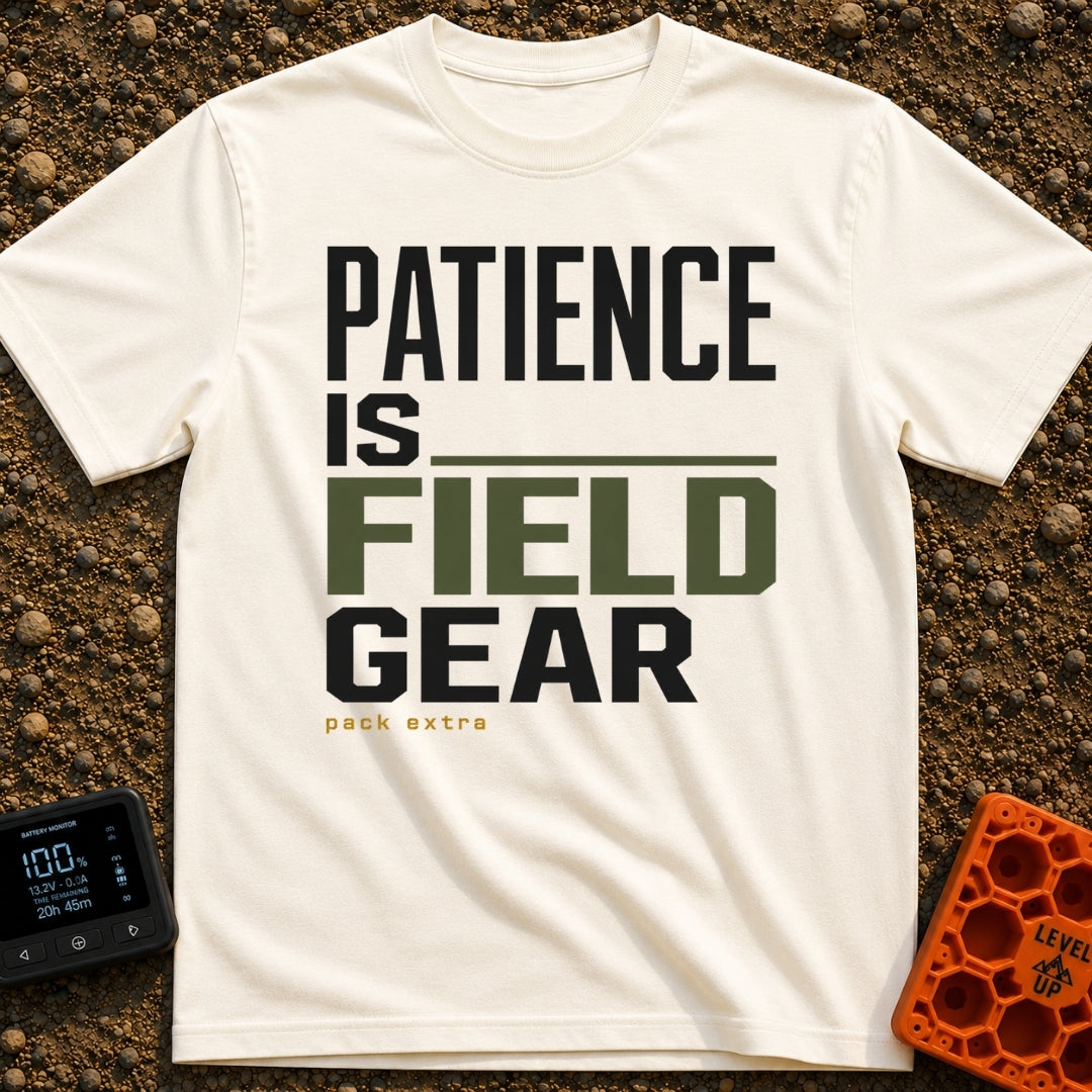 Patience Is Field Gear - T-Shirt in Ivory - A typographic design featuring the stacked text "PATIENCE IS FIELD GEAR" in...