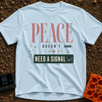 Peace Needs No Signal - T-Shirt in Chambray - A typographic design reading "PEACE DOESN'T NEED A SIGNAL" accompanied by...