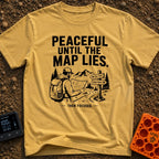 Peaceful Until Maps Lie - T-Shirt in Mustard - A black and white illustration of a bearded hiker wearing a backpack and...
