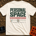 Measured In Campsites - T-Shirt in Ivory - The design features large text reading "PERSONAL SPACE" and "MEASURED IN...
