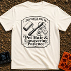 Powered By Pet Hair - T-Shirt in Ivory - A vintage-style black and white illustration featuring a lint roller next to two...