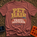 Fur Is A Souvenir - T-Shirt in Brick - A typographic design featuring the text "PET HAIR IS A TRAVEL SOUVENIR" and...