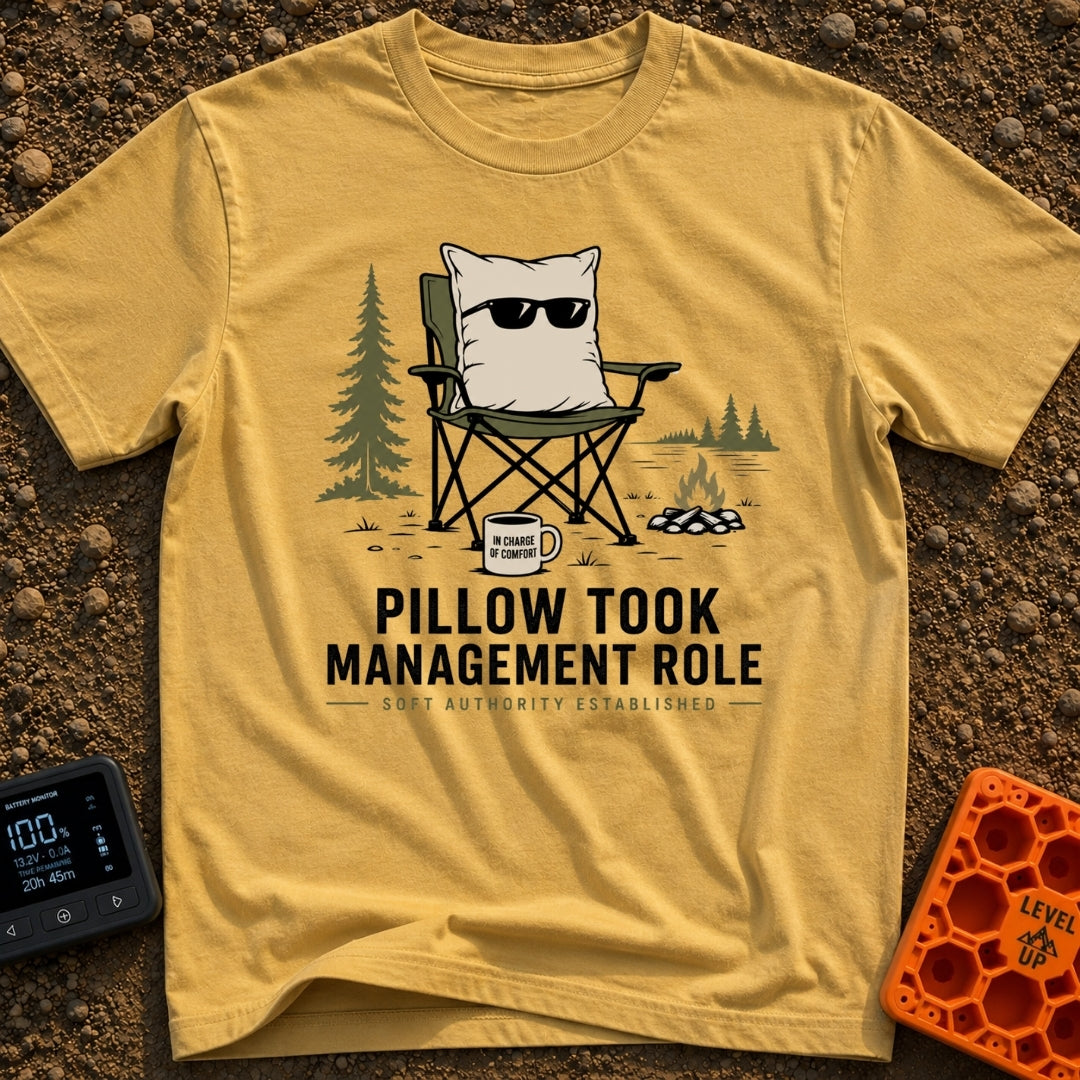 Pillow CEO Vibes - T-Shirt in Mustard - A cartoon illustration of a large pillow wearing sunglasses sitting in a green...