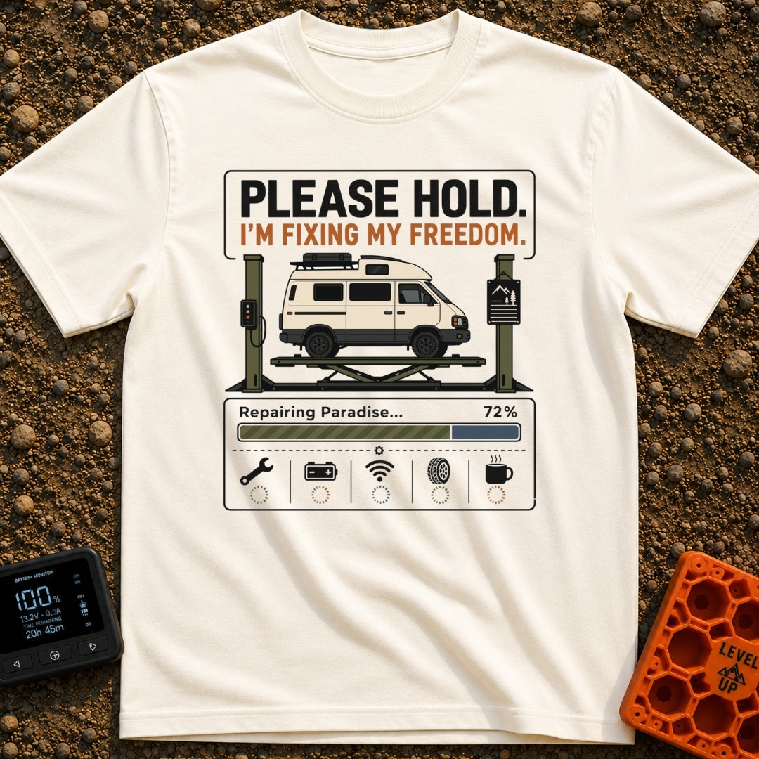 Fixing My Freedom - T-Shirt in Ivory - A white camper van is shown elevated on a green auto lift beneath the text "PLEASE...