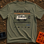 Fixing My Freedom - T-Shirt in Moss - A white camper van is shown elevated on a green auto lift beneath the text "PLEASE...