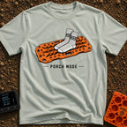 Sliding Into Porch Mode - T-Shirt in Bay - An illustration of a pair of thick, patterned knit socks resting on top of an...