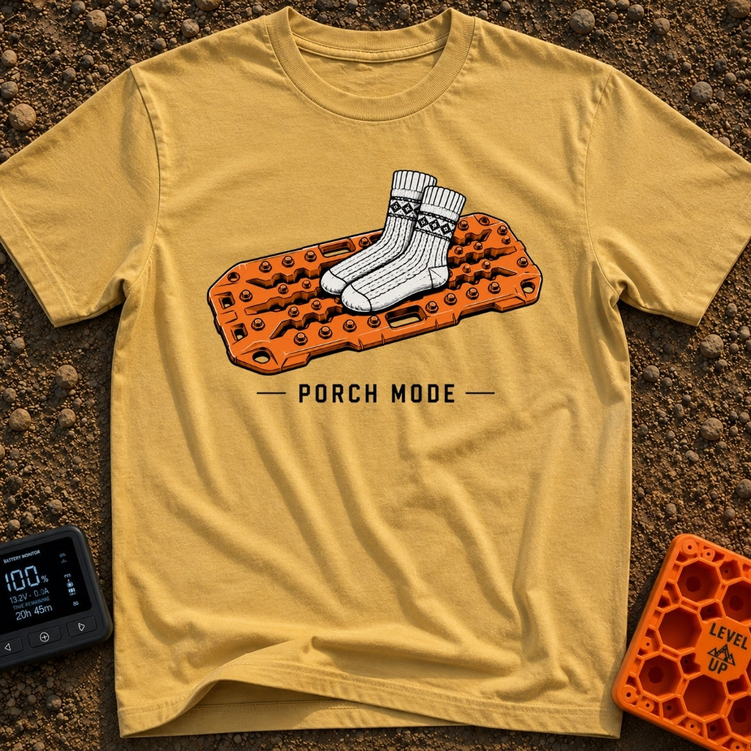 Sliding Into Porch Mode - T-Shirt in Mustard - An illustration of a pair of thick, patterned knit socks resting on top of...