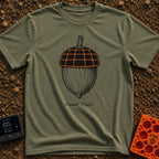Solar Powered Nut - T-Shirt in Moss - A black and white illustration of an acorn where the top cap is designed to look...