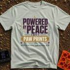 Peaceful Paw Power - T-Shirt in Bay - A typographic design featuring the phrases "POWERED BY PEACE AND PAW PRINTS" and...