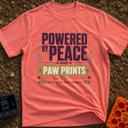 Peaceful Paw Power - T-Shirt in Watermelon - A typographic design featuring the phrases "POWERED BY PEACE AND PAW PRINTS"...