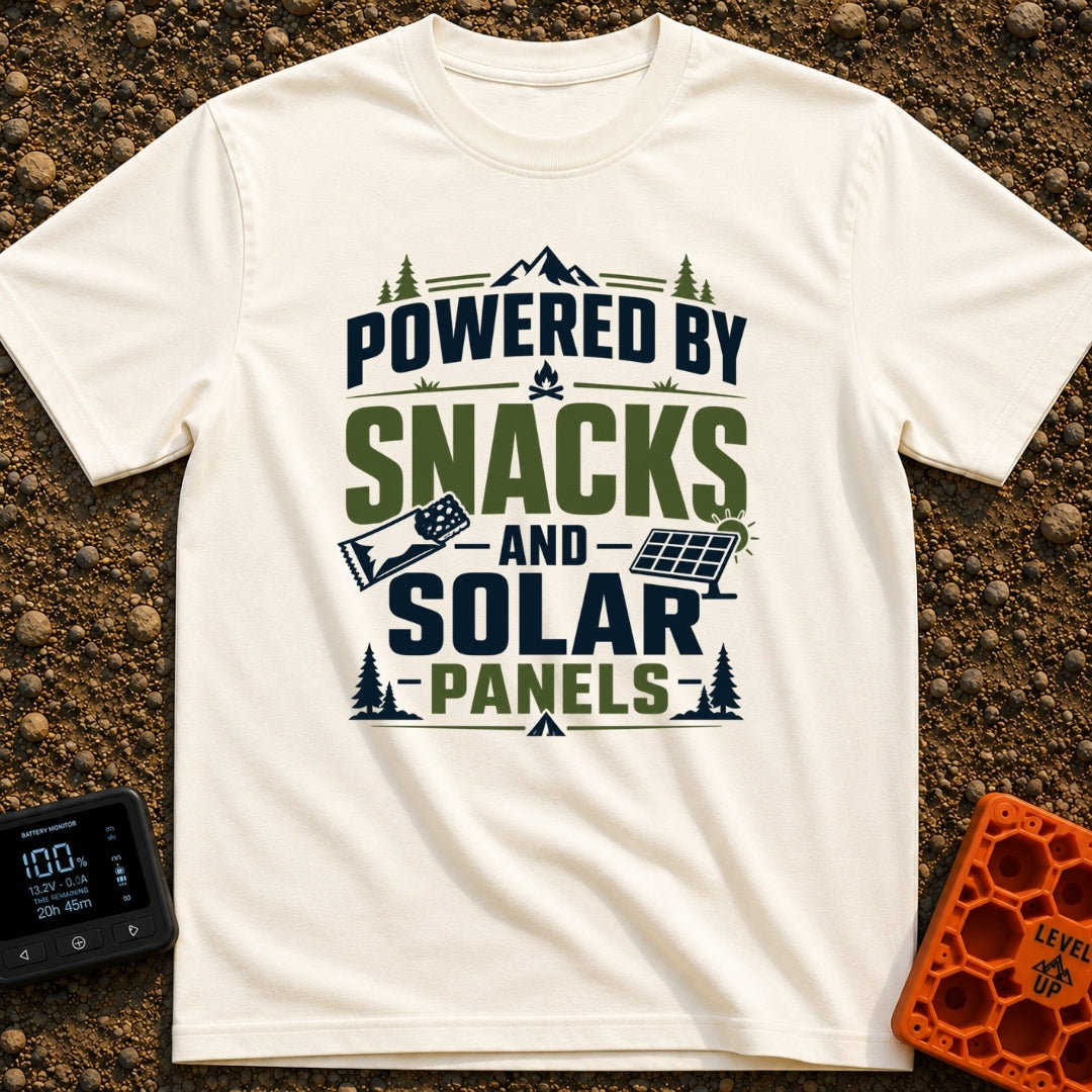 Snacks And Solar Powered - T-Shirt in Ivory - A typographic design featuring the text "POWERED BY SNACKS AND SOLAR...