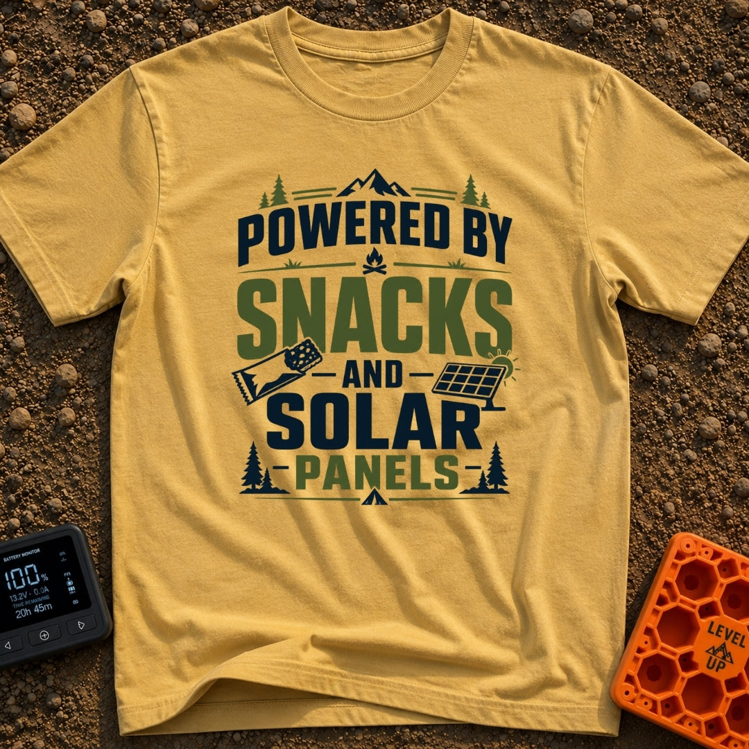 Snacks And Solar Powered - T-Shirt in Mustard - A typographic design featuring the text "POWERED BY SNACKS AND SOLAR...