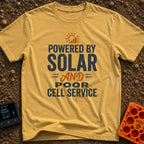 No Bars All Solar - T-Shirt in Mustard - A typographic design featuring the text "POWERED BY SOLAR AND POOR CELL SERVICE"...