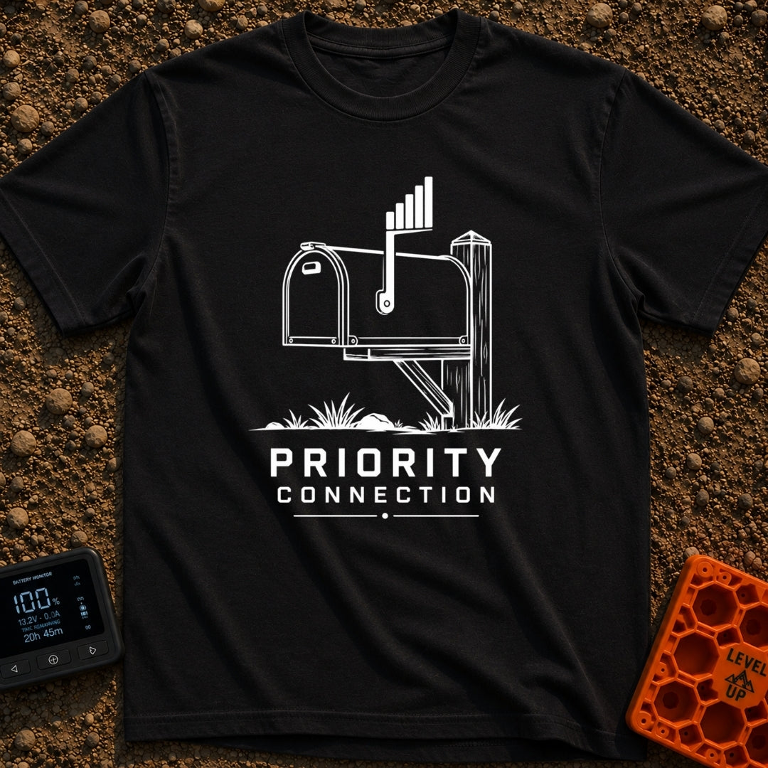 Priority Mail Connection - T-Shirt in Black - A black and white illustration of a classic roadside mailbox on a wooden...