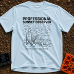 Campsite Connoisseur Club - T-Shirt in Chambray - A line drawing of a person sitting in a camp chair looking at the sun...