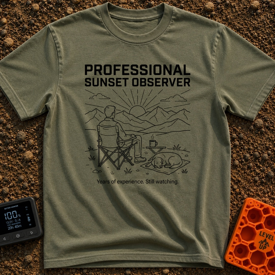 Campsite Connoisseur Club - T-Shirt in Moss - A line drawing of a person sitting in a camp chair looking at the sun...