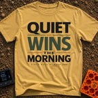 Quiet Wins Mornings - T-Shirt in Mustard - A typographic design featuring the stacked phrase "QUIET WINS THE MORNING" in...