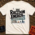 Peak Raccoon Energy - T-Shirt in Ivory - A graphic illustration featuring the text 'Raccoon Energy Campground Edition'...