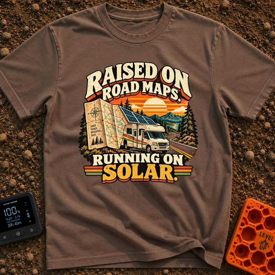 Raised On Roadmaps - T-Shirt in Espresso - A retro-style motorhome with a large solar panel on its roof drives along a...