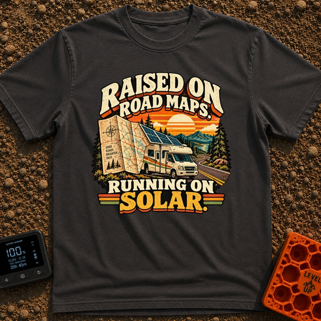 Raised On Roadmaps - T-Shirt in Graphite - A retro-style motorhome with a large solar panel on its roof drives along a...