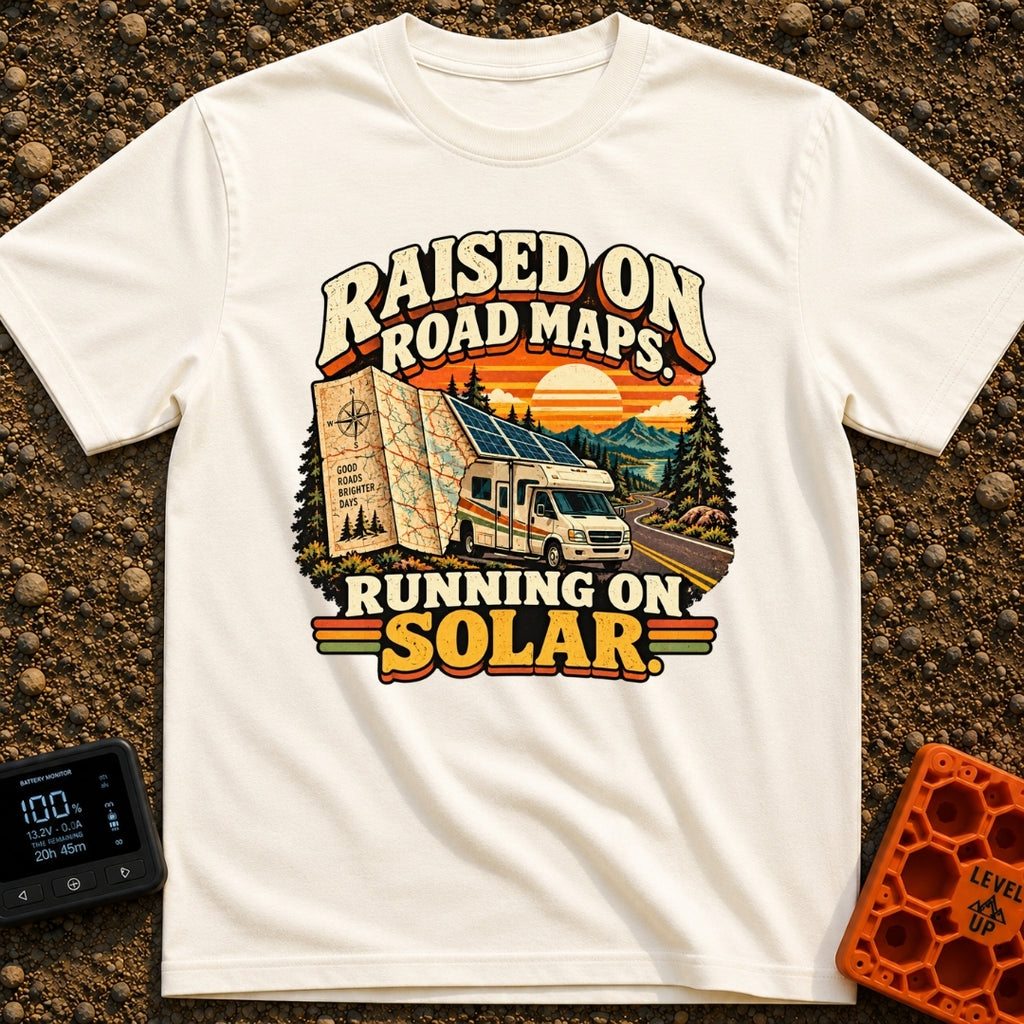Raised On Roadmaps - T-Shirt in Ivory - A retro-style motorhome with a large solar panel on its roof drives along a...