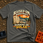 Raised On Roadmaps - T-Shirt in Pepper - A retro-style motorhome with a large solar panel on its roof drives along a...