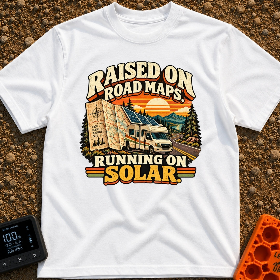 Raised On Roadmaps - T-Shirt in White - A retro-style motorhome with a large solar panel on its roof drives along a...