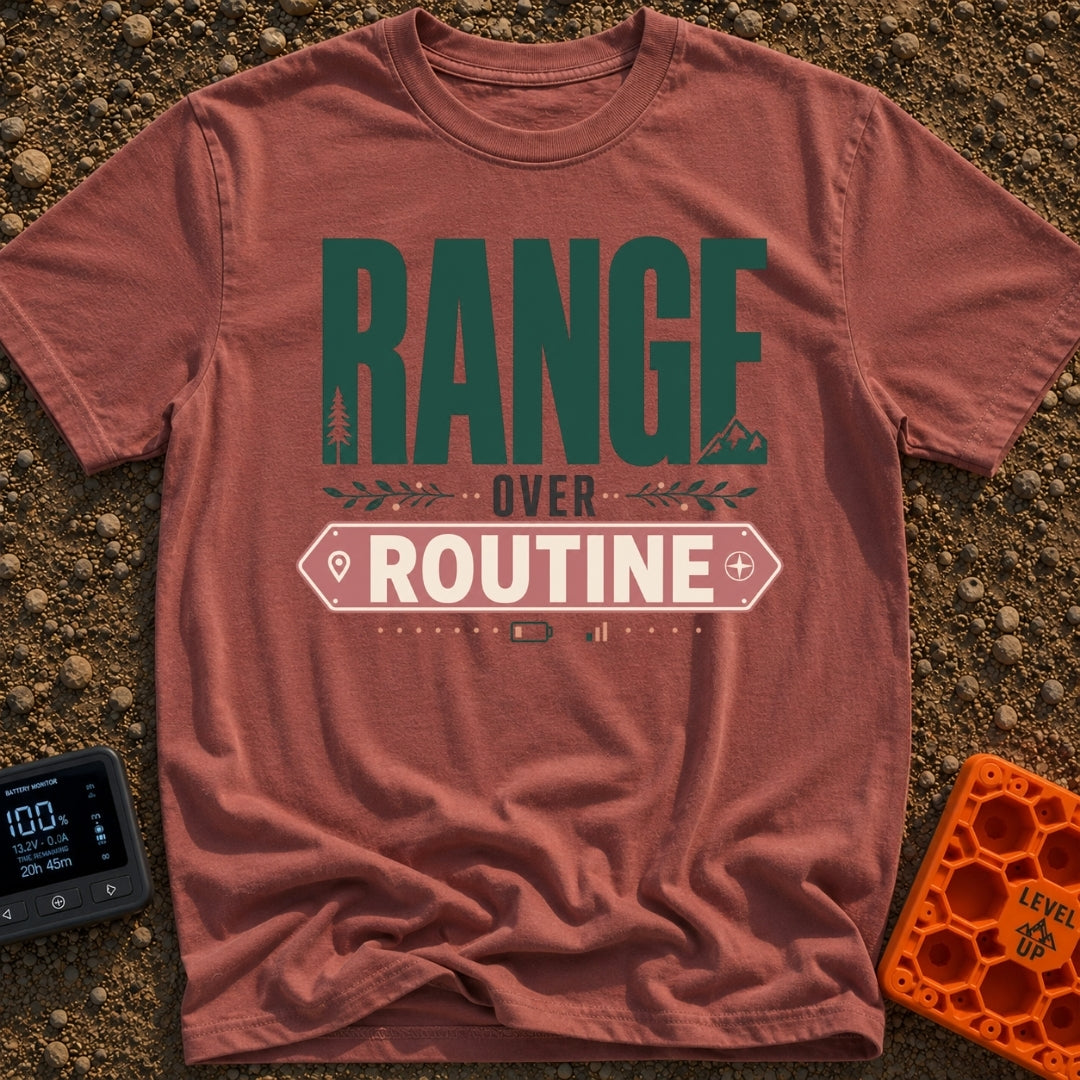 Roam Over Routine - T-Shirt in Brick - Typographic design featuring the large green word "RANGE" with a pine tree and...