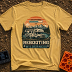 Ctrl Alt Retreat - T-Shirt in Mustard - An illustration of an RV parked by a mountain lake with solar panels and a...