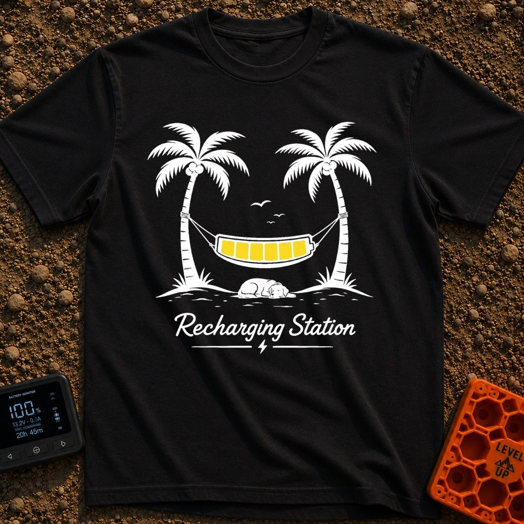 Unplug To Recharge - T-Shirt in Black - A black and white illustration of two palm trees with a hammock strung between...