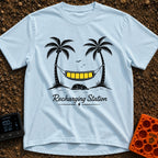 Unplug To Recharge - T-Shirt in Chambray - A black and white illustration of two palm trees with a hammock strung between...