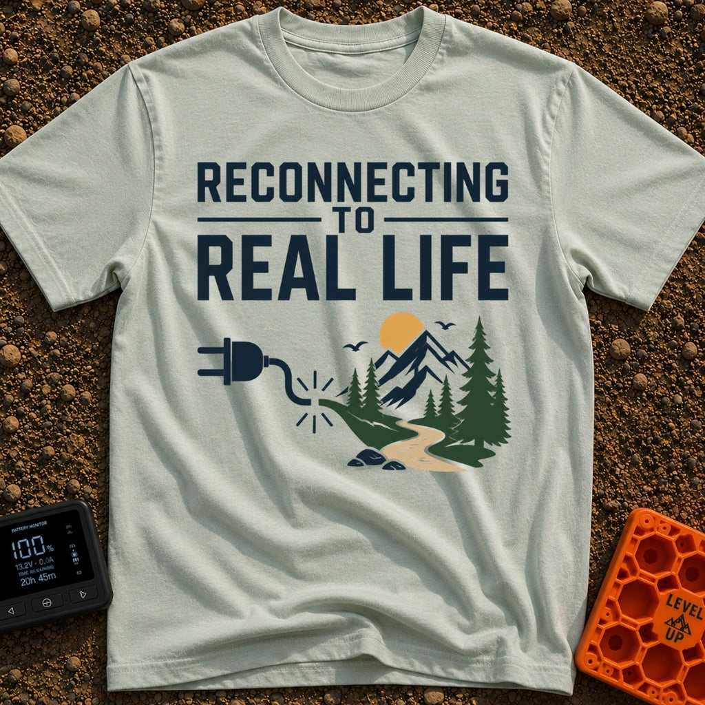 Logging Into Life - T-Shirt in Bay - The design displays the text "RECONNECTING TO REAL LIFE" above an illustration of an...