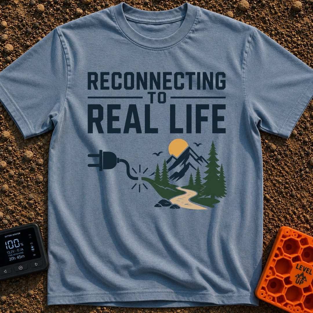 Logging Into Life - T-Shirt in Blue Jean - The design displays the text "RECONNECTING TO REAL LIFE" above an illustration...