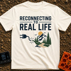 Logging Into Life - T-Shirt in Ivory - The design displays the text "RECONNECTING TO REAL LIFE" above an illustration of...