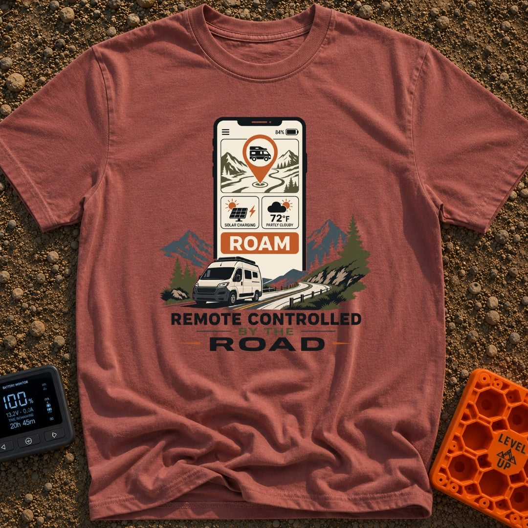 Remote Control Roamer - T-Shirt in Brick - A large smartphone displays an app with a camper van map pin, a solar charging...