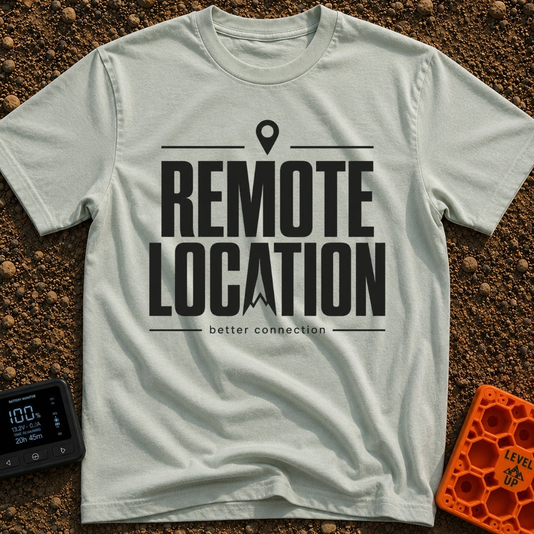Working From Nowhere - T-Shirt in Bay - Text reading 'REMOTE LOCATION' in large black letters with the 'A' stylized as a...