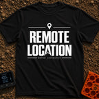 Working From Nowhere - T-Shirt in Black - Text reading 'REMOTE LOCATION' in large black letters with the 'A' stylized as...