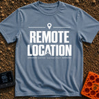 Working From Nowhere - T-Shirt in Blue Jean - Text reading 'REMOTE LOCATION' in large black letters with the 'A' stylized...